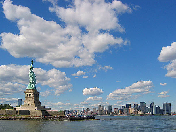 istock Statue of Liberty Overlooking New York Skyline 471887909