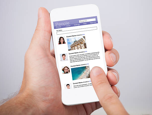 istock Hand Holding Smartphone With Social Site Displayed On Screen 471888038