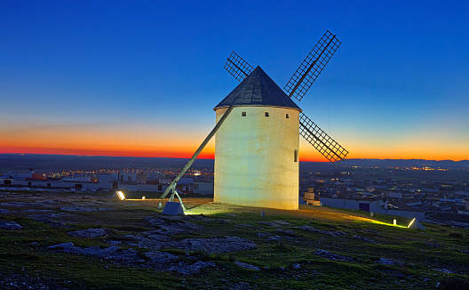 windmill  at field in evening time. La Mancha, Spain