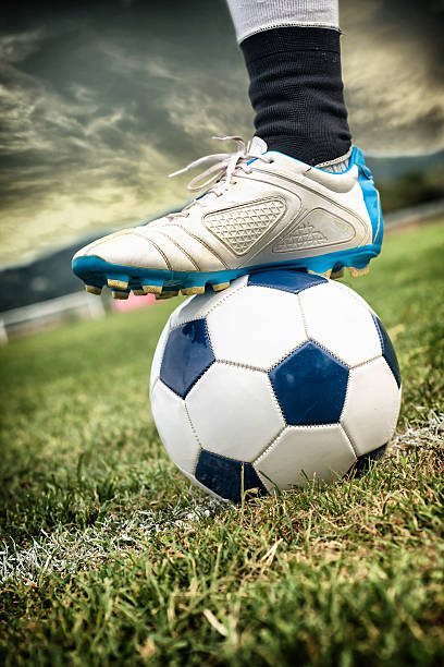 istock Foot on Soccer Ball 471889867