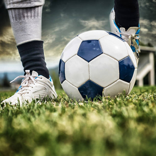 istock kicking a Soccer Ball 471889951