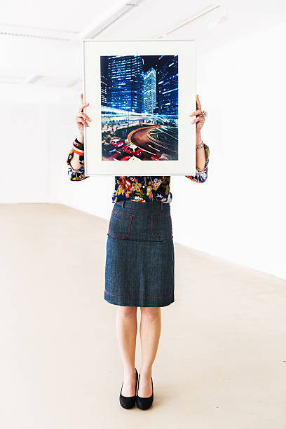 istock Gallery Owner Holding Picture Frame 471889953