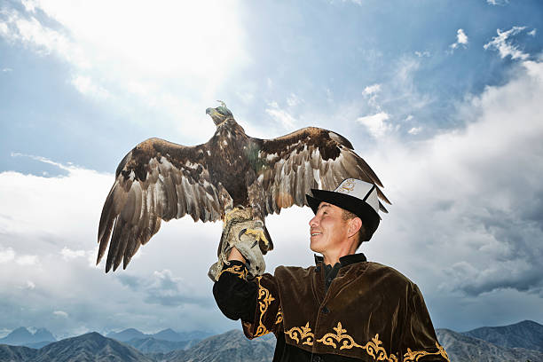 istock Traditional Kyrgyz Hunter Holding Eagle 471889971
