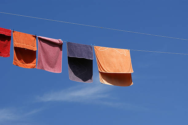 istock Multi-colored towels against the blue sky 471890535