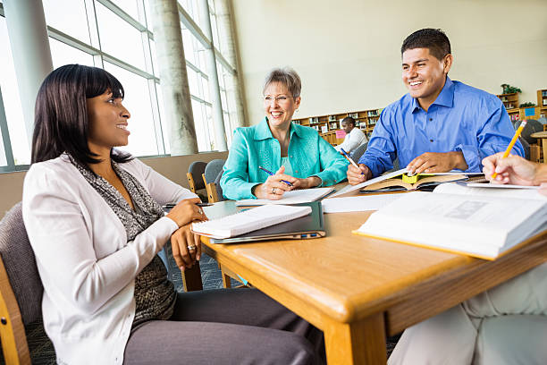 istock Diverse group of adult students studying for college exam 471890967