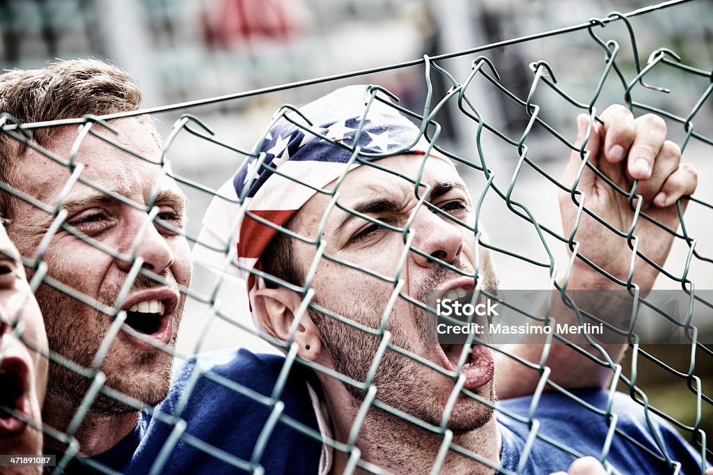 Sports fans cheering a game Applauding Stock Photo