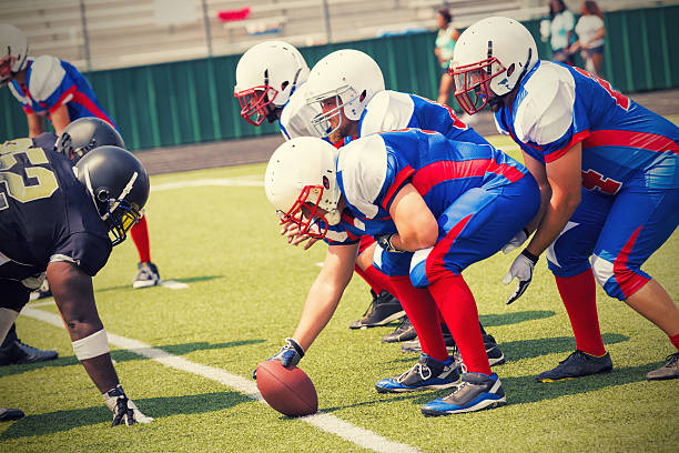 istock Team preparing to punt football during semi-pro game 471891167