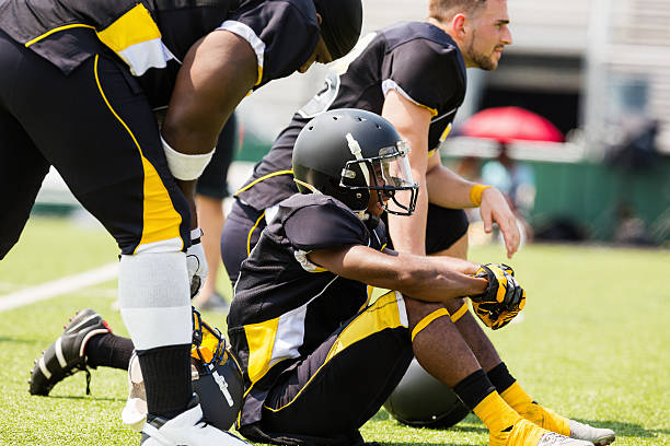 istock Pro football players sitting on sidelines during game 471891173