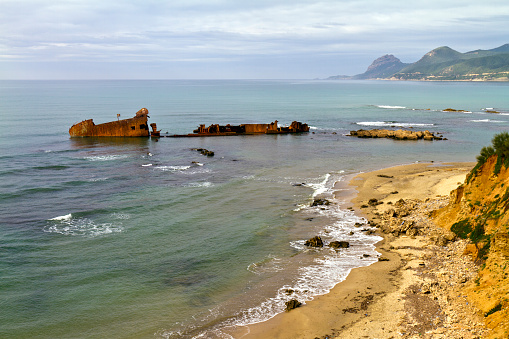 Algeria, Annaba Province, coastline with shipwreck.
