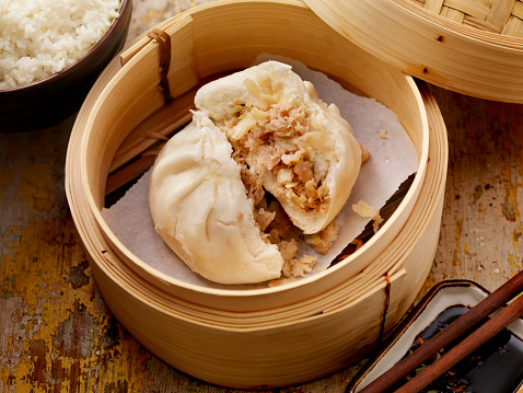 Steamed Pork Bun in a bamboo steamer with soya sauce and rice -Photographed on Hasselblad H1-22mb Camera