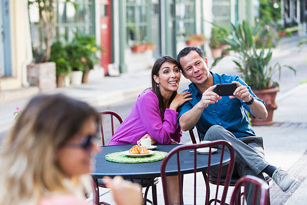 istock Hispanic couple at sidewalk cafe 471891559
