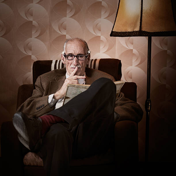 istock Old man in living room 471891825