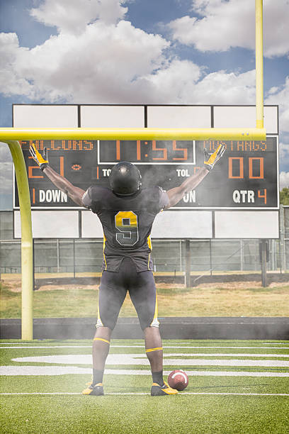 american football field goal post with empty field