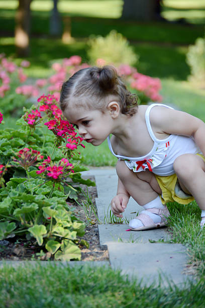 istock baby child playing in garden 471891892