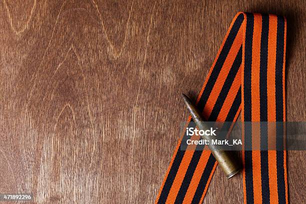 St George Ribbon And Old Shell Stock Photo - Download Image Now - 2015, Abstract, Armed Forces