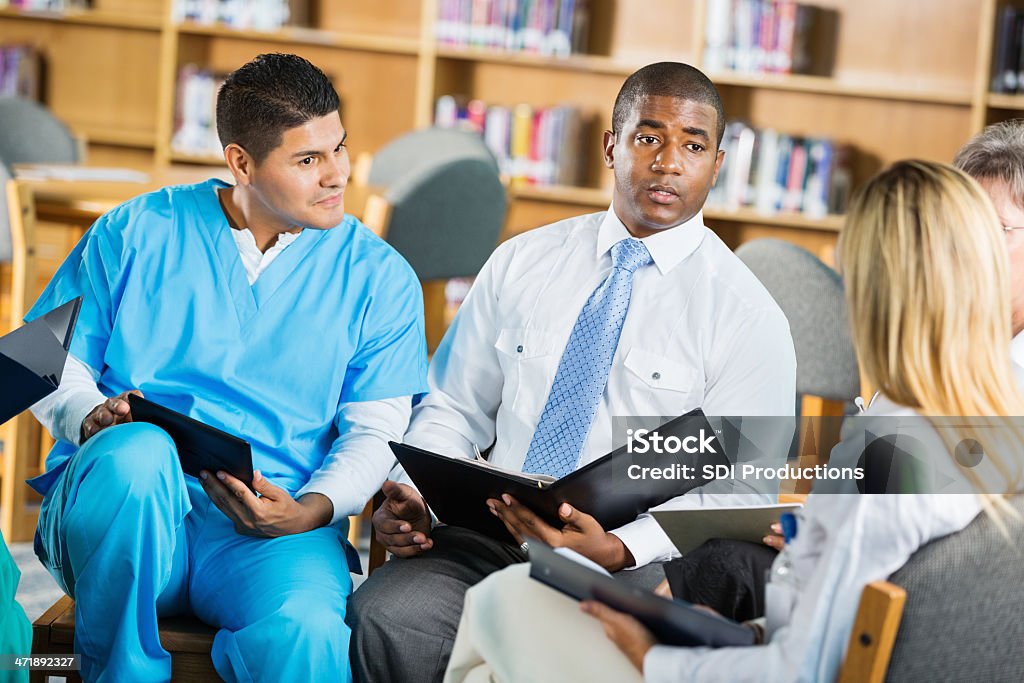 Hopital doctors and staff having meeting to discuss policies Administrator Stock Photo