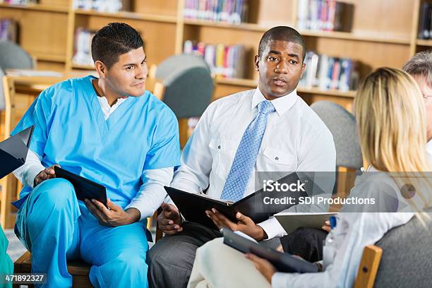 Hopital Doctors And Staff Having Meeting To Discuss Policies Stock Photo - Download Image Now