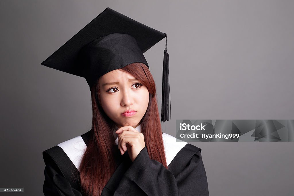 graduate student woman think student woman graduating and think and look empty area isolated on white background, asian beauty 2015 Stock Photo