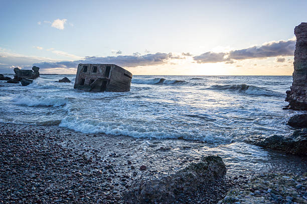 istock waves crushing over rocks in sunset 471893642
