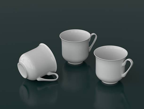 istock Three white porcelain teacups on a dark background 471893784
