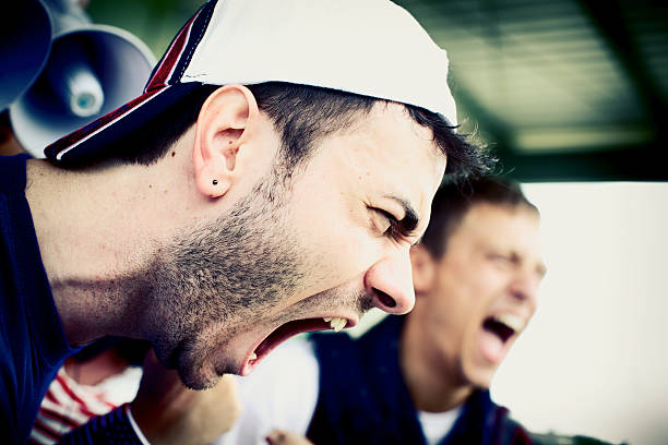Concept of emotions, stress, madness and people, crazy man screaming with his eyes closed and mouth wide open, with his arms wide open