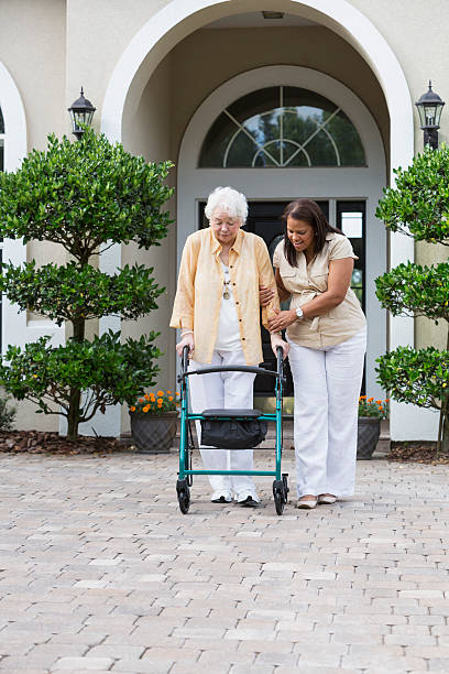istock Senior woman with caregiver 471894495