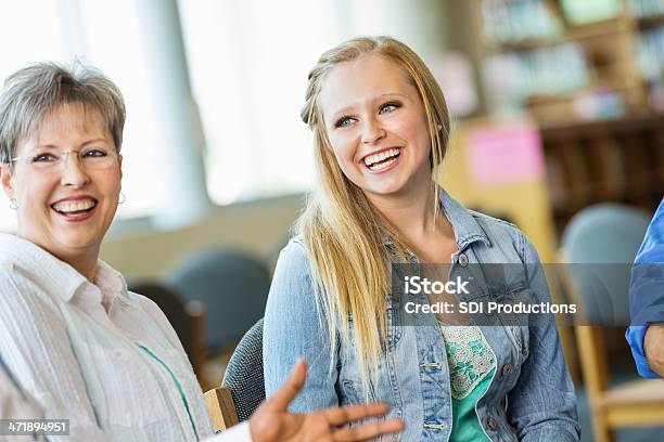 Teens And Adults Talking Together During Discussion Group Meeting Stock Photo - Download Image Now