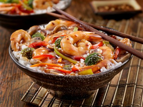 Teriyaki Shrimp Rice Bowl with Broccoli, Carrots,Peppers, Mushrooms and Chopsticks - Photographed on a Hasselblad H3D11-39 megapixel Camera System