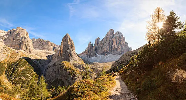 A steep path leads towards a wonderful mountain scenery in the Dolomites Italy an Unesco world heritage site.