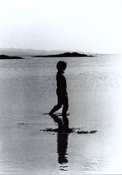 istock Woman wading the sea 471896439