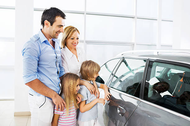 istock Family buying a new car. 471897465