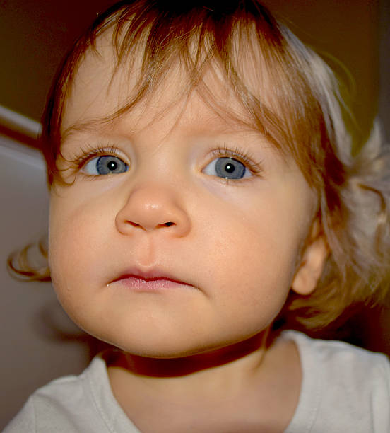 istock Cute, Blue Eyed Baby with Blond Curls 471897466