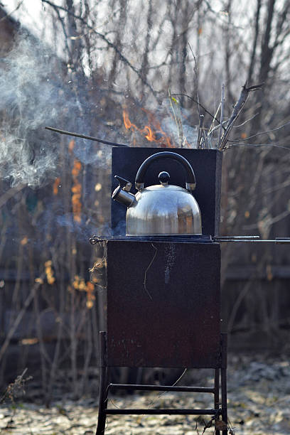 istock the whistling kettle begins to boil on a brazier 471897540