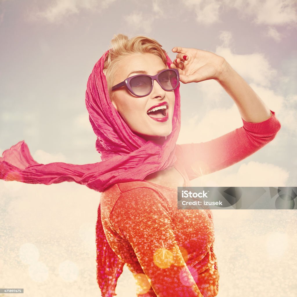 Summer Woman, Glamour Portrait Glamour portrait of happy elegance woman wearing red scarf and sunglasses with sky in the background. Studio shot. Women Stock Photo