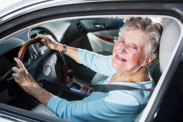 istock Senior woman driving car 471898237