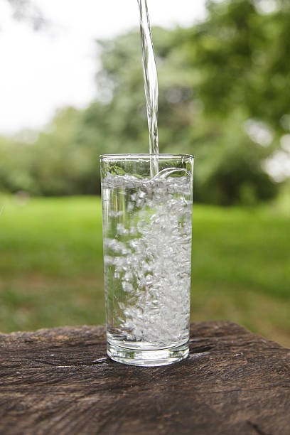 istock Pouring water into a glass 471899017