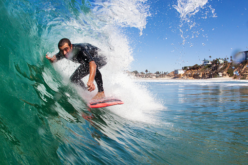 surfer in the barrel of a wave