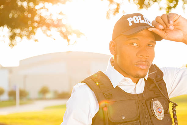 istock Law:  Policeman wearing safety vest.  Lensflare 471899241