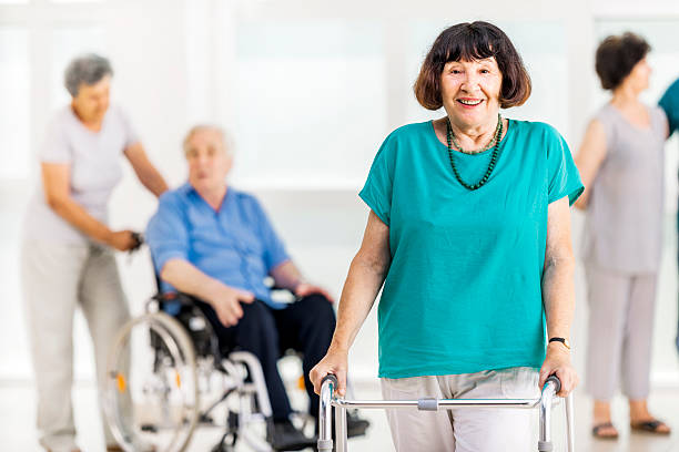 istock Smiling senior woman with walker. 471899365