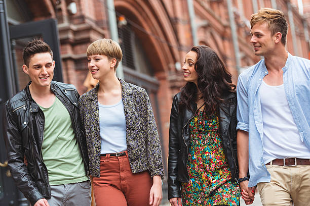 istock Smiling friends walking togetherness outdoors 471900113