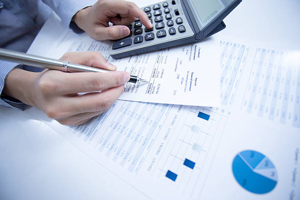 istock woman hand and business report 471900619