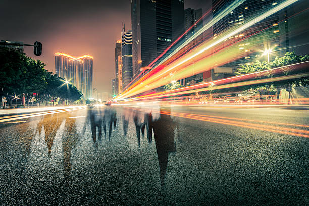 istock blur people and traffic on a street at night 471900823