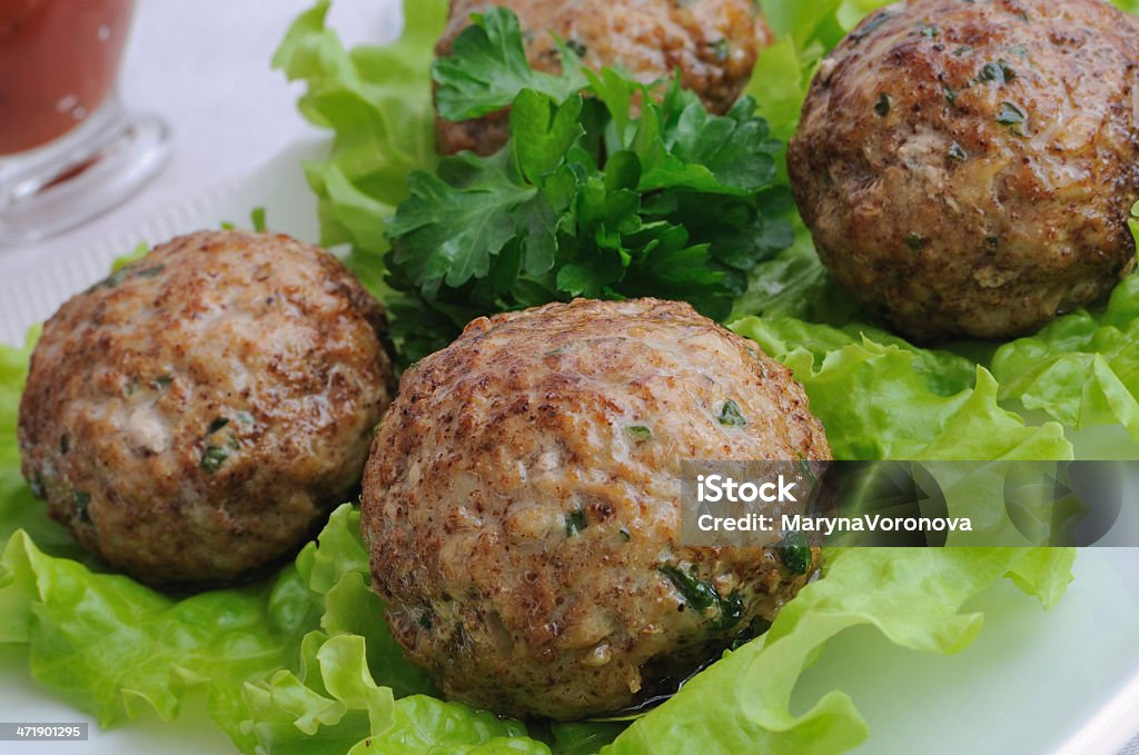 Meatballs with herbs Meatballs with greens on salad leaves closeup Appetizer Stock Photo