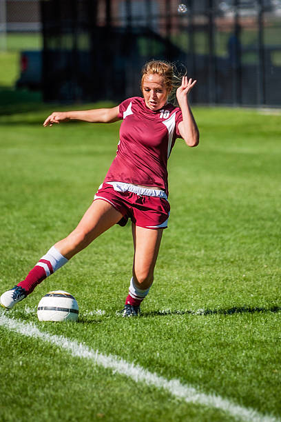 istock Female Soccer Player Stretches fo Line Save with Copy Space 471901541