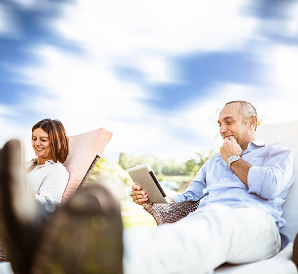 istock happiness mature couple embracing and surfing 471902213