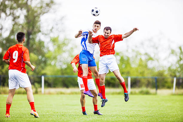 istock Soccer players heading the ball. 471902285