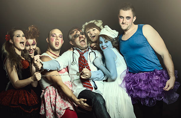 Halloween people seven friends in Halloween costumes having fun and posing. Halloween drag stock pictures, royalty-free photos & images