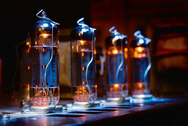 Set of glowing vintage guitar amplifier vacuum electron tubes