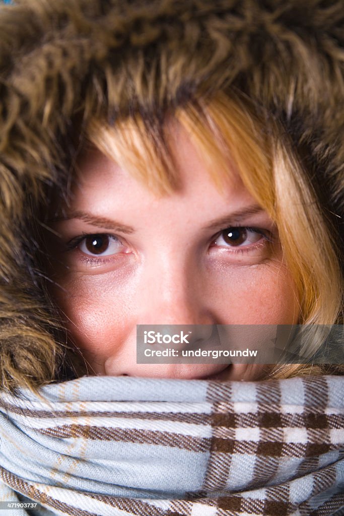 Headshot of woman in winter clothes Headshot of smiling young blonde woman in parka and scarf. 1920-1929 Stock Photo