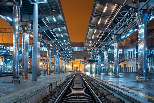 istock Railway station at night. Train platform in fog. Railroad 471905374